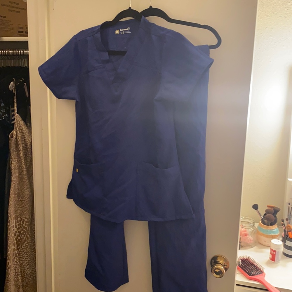 “Spread good cheer” branded scrubs .